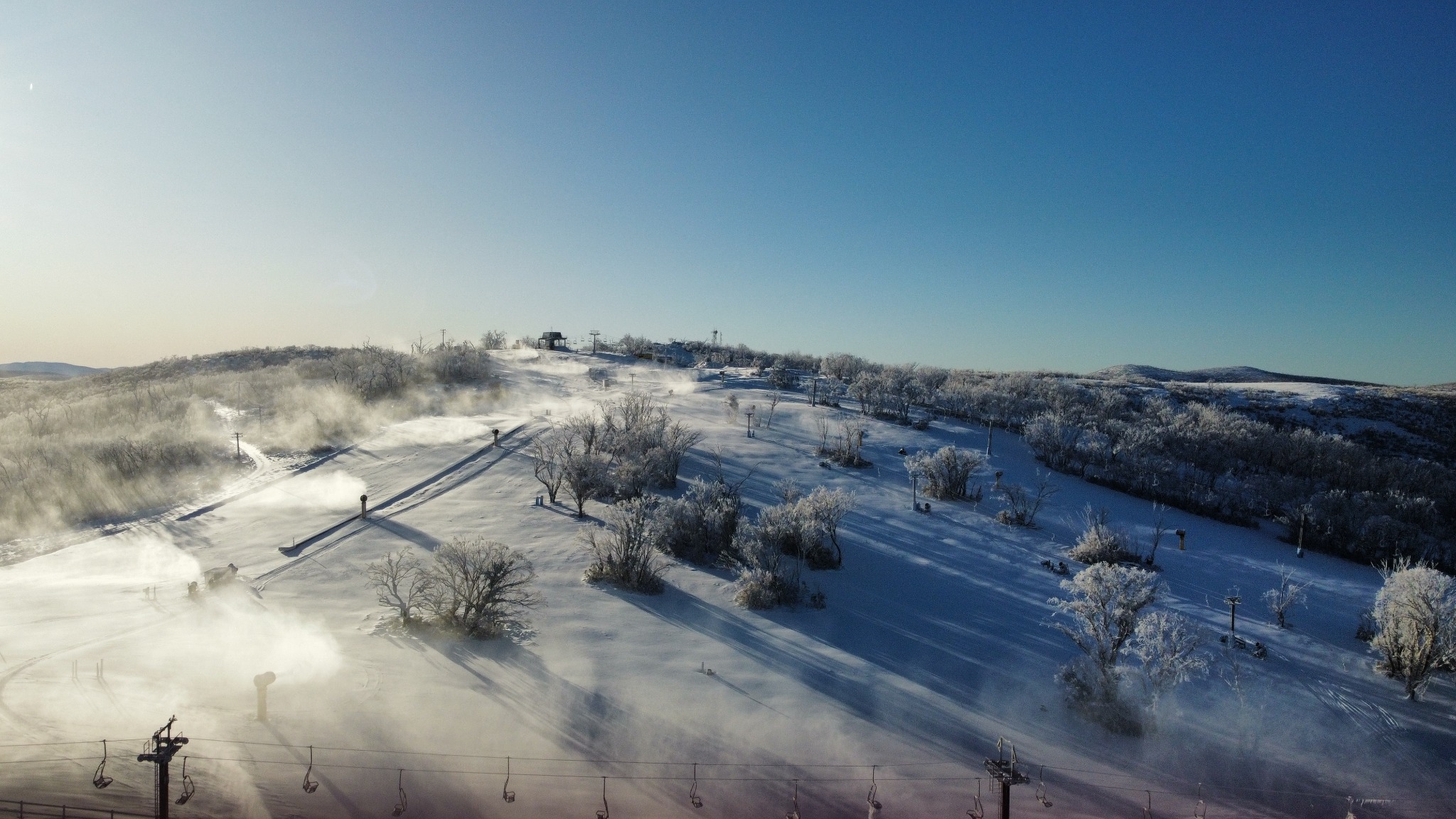 Multiple automated snowguns operating across Selwyn Snow Resort